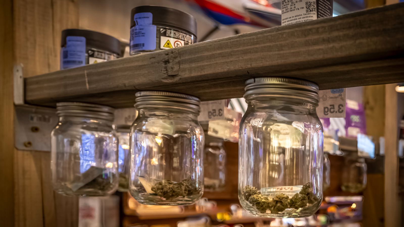 Stocked product shelves inside a Farmers Choice dispensary